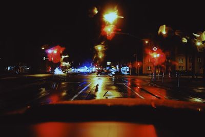 Cars on road in city at night