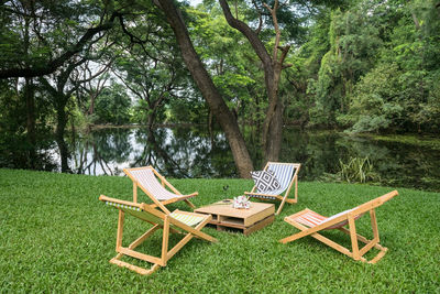 Empty chairs and tables in park