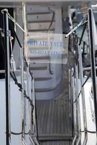 Close-up of text on metal railing