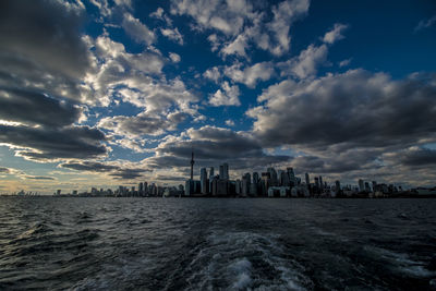 Scenic view of sea and buildings against sky