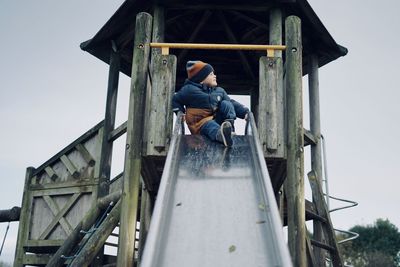 Cute boy playing in yard house 