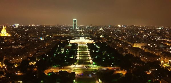 High angle view of illuminated buildings in city at night