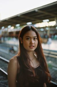 Portrait of a beautiful young woman in car