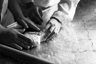 Close-up of woman preparing food on table