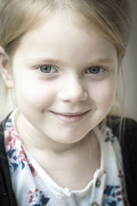 Close-up portrait of smiling girl