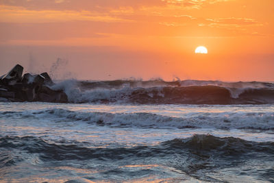 Scenic view of sea against sky during sunset