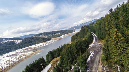 Panoramic view of trees and mountains against sky