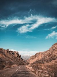 Scenic view of arid landscape against sky