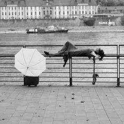 Rear view of woman on riverbank
