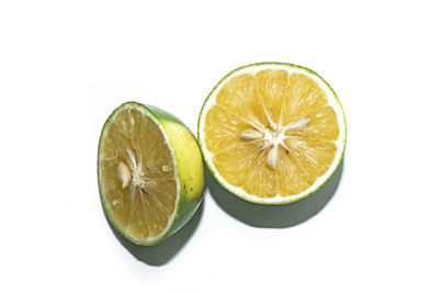 Close-up of lemon slice against white background