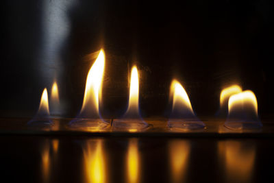 Close-up of burning candles