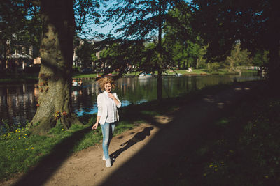 Full length of woman standing on pathway at park