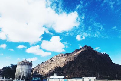Low angle view of building against cloudy sky
