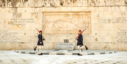 People in front of old building