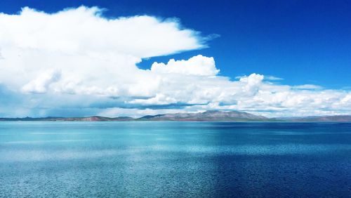 Scenic view of sea against cloudy sky