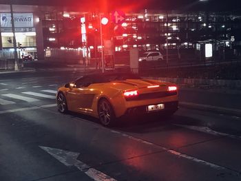 Car on city street at night