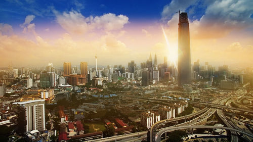 High angle view of modern buildings in city against sky