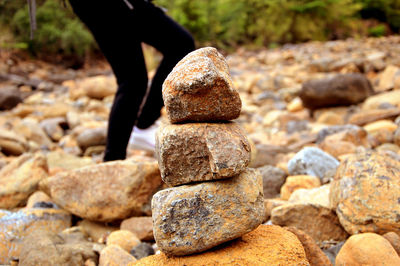 Person standing on stones