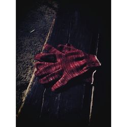 High angle view of red hanging on wooden door