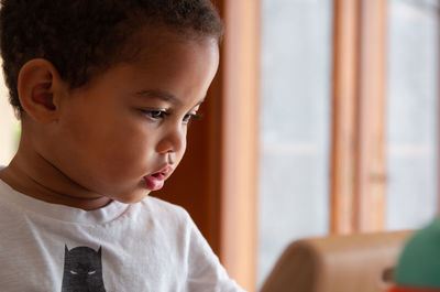 Portrait of boy looking at home