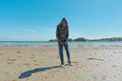 Full length of man standing at beach