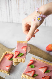 Close-up of person preparing food on table