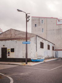 Cars on street against buildings in city