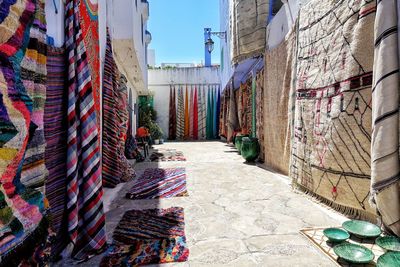 Alley amidst buildings against sky