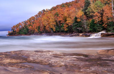 Scenic view of sea against sky during autumn