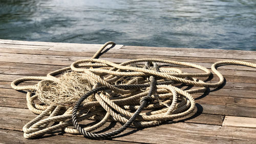 High angle view of rope tied to pier