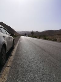 Car on road against clear sky