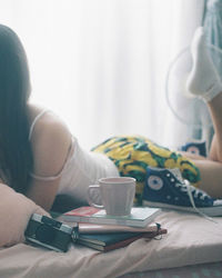 Woman holding coffee cup