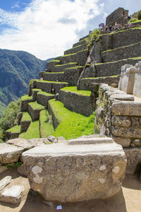 Ruins of temple against cloudy sky