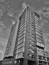 Low angle view of office building against sky