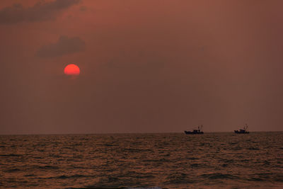 Scenic view of sunset over sea