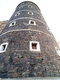 Low angle view of old building against sky