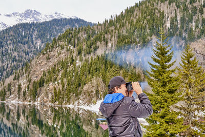 Full length of man photographing on mountain