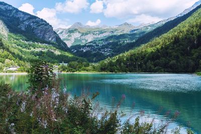 Scenic view of lake and mountains against sky