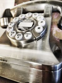 Close-up of telephone on table