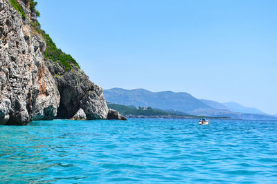 Scenic view of sea against clear blue sky