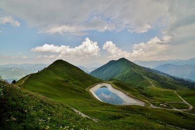 Scenic view of landscape and mountains against sky