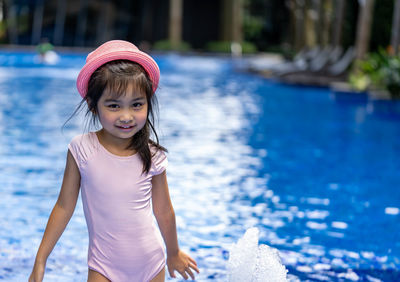 Portrait of smiling girl in swimming pool