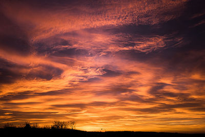 Scenic view of dramatic sky during sunset