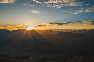 Scenic view of mountains against sky during sunset