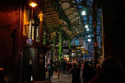 People in illuminated room at night