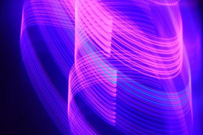 Full frame shot of light painting against black background