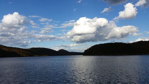 Scenic view of sea against cloudy sky