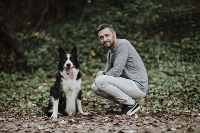 Portrait of man with dog