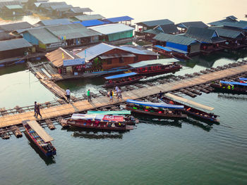 Boats in harbor with buildings in background