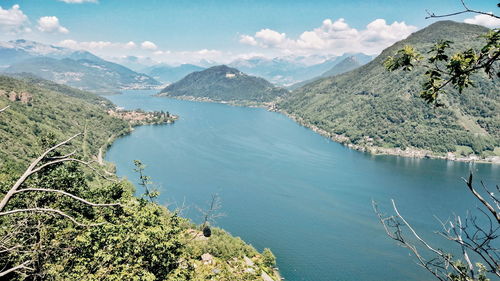 High angle view of sea and mountains against sky